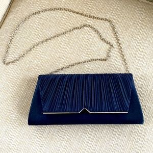 Navy blue evening bag with silver detail accents .used one time.